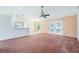 Spacious living room featuring a ceiling fan and neutral walls at 12124 Colonial Estates Ln, Riverview, FL 33579