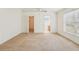 Spacious main bedroom with ceiling fan and en suite bathroom entrances at 12124 Colonial Estates Ln, Riverview, FL 33579