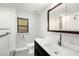 Updated bathroom featuring marble countertop and modern fixtures at 14 Idlewilde Dr, Safety Harbor, FL 34695