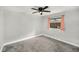 Bedroom featuring neutral walls and a large window with peach curtains at 14 Idlewilde Dr, Safety Harbor, FL 34695