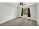 Clean bedroom features a window and neutral color palette at 14 Idlewilde Dr, Safety Harbor, FL 34695