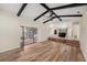 Bright and airy living room with hardwood floors, access to the outside patio, and views of the adjacent kitchen and dining area at 14 Idlewilde Dr, Safety Harbor, FL 34695