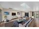 Sunlit living room featuring skylights, stylish furniture, and an open floor plan with elegant decor, creating a welcoming atmosphere at 14 Idlewilde Dr, Safety Harbor, FL 34695