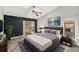 Comfortable main bedroom with vaulted ceilings and a sliding glass door to the backyard at 14 Idlewilde Dr, Safety Harbor, FL 34695