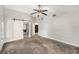 Large bedroom featuring neutral walls and a sliding barn door to the walk-in closet at 14 Idlewilde Dr, Safety Harbor, FL 34695