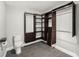 Walk-in closet with custom shelving, built-in drawers, and a toilet for added convenience at 14 Idlewilde Dr, Safety Harbor, FL 34695