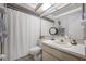 Neutral bathroom featuring vanity, shower with curtain and tiled floor at 15344 E Pond Woods Dr, Tampa, FL 33618