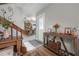 Bright entryway features wood floors, staircase, decorative table, and access to dining area at 15344 E Pond Woods Dr, Tampa, FL 33618