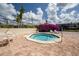 Community hot tub surrounded by lush landscaping and lounge chairs, for ultimate relaxation at 15344 E Pond Woods Dr, Tampa, FL 33618