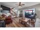 Inviting living room with wood floors, staircase, access to patio, and ample seating at 15344 E Pond Woods Dr, Tampa, FL 33618