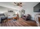 Comfortable living room features hardwood floors, soft seating, and a stylish wine rack at 15344 E Pond Woods Dr, Tampa, FL 33618