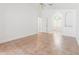 An empty bedroom showing an arched doorway leading to the attached bathroom at 18005 Palm Breeze Dr, Tampa, FL 33647