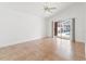 An empty bedroom with tile flooring and sliding glass doors leading to the pool at 18005 Palm Breeze Dr, Tampa, FL 33647