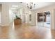 Open-concept living with tile floors and kitchen access, leading to a screened pool area at 18005 Palm Breeze Dr, Tampa, FL 33647