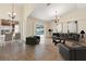 Bright living room featuring modern furnishings, neutral colors, and sliding glass doors to the pool area at 18005 Palm Breeze Dr, Tampa, FL 33647