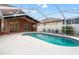 Gorgeous pool and patio area with screened enclosure; enjoy outdoor living year-round! at 18005 Palm Breeze Dr, Tampa, FL 33647
