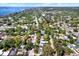 Overhead view of a quiet suburban neighborhood nestled among lush greenery and close to the waterfront at 2049 Broadway, Clearwater, FL 33755