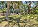 Fenced backyard with mature trees providing ample shade and privacy at 2049 Broadway, Clearwater, FL 33755