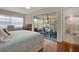 Bedroom featuring a screened-in porch and an adjacent bathroom at 2049 Broadway, Clearwater, FL 33755