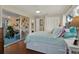 Bedroom featuring sliding doors to porch and decorative fish wall hangings at 2049 Broadway, Clearwater, FL 33755