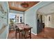 Charming dining area with a decorative light fixture, a table with four chairs, and natural light at 2049 Broadway, Clearwater, FL 33755