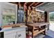 Organized garage with workbench, tools, and storage cabinets at 2049 Broadway, Clearwater, FL 33755