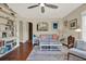 Cozy living room featuring hardwood floors, comfortable seating, and stylish decor at 2049 Broadway, Clearwater, FL 33755