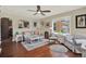 Inviting living room with hardwood floors, neutral colors, and large windows providing ample natural light at 2049 Broadway, Clearwater, FL 33755