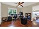 Bright office space features hardwood floors, a large window and a ceiling fan at 2049 Broadway, Clearwater, FL 33755
