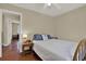 Comfortable bedroom with hardwood floors, side table, and serene atmosphere at 2049 Broadway, Clearwater, FL 33755