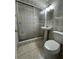 Bathroom featuring a shower and tile flooring at 2117 W Clifton St, Tampa, FL 33603