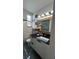 Stylish bathroom featuring a modern vanity with black countertops and a gold mirror at 2117 W Clifton St, Tampa, FL 33603