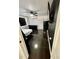 Bedroom with modern design, black tile flooring, mini fridge and air conditioner at 2117 W Clifton St, Tampa, FL 33603