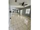 Bedroom with tile flooring, mirrored closet doors, and natural light from a window at 2117 W Clifton St, Tampa, FL 33603
