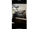 Sleek bedroom featuring dark walls, a flat screen TV, and tiled floors at 2117 W Clifton St, Tampa, FL 33603