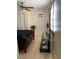 Bedroom featuring a ceiling fan, TV on a stand, and a large window with natural light at 2117 W Clifton St, Tampa, FL 33603