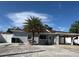 Charming single story home features a carport, palm tree, and an inviting front porch at 2117 W Clifton St, Tampa, FL 33603