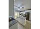 Well-lit kitchen featuring granite countertops, an island, and stainless steel appliances at 2117 W Clifton St, Tampa, FL 33603