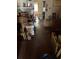 Living room with hardwood floors, fireplace, and contents scattered on the floor at 2451 Quincy S St, St Petersburg, FL 33711