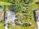 From above, the house boasts a sparkling pool, large lawn, and an oasis of palm trees at 26180 Deep Creek Blvd, Punta Gorda, FL 33983