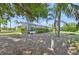 Enjoy this backyard with screened pool, green landscaping and privacy hedges and trees at 26180 Deep Creek Blvd, Punta Gorda, FL 33983