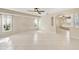 Bright bedroom features a ceiling fan, and tiled floors at 26180 Deep Creek Blvd, Punta Gorda, FL 33983