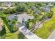 Beautiful one-story home with a well-manicured lawn, palm trees, and a long driveway leading to an attached garage at 26180 Deep Creek Blvd, Punta Gorda, FL 33983