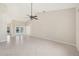 Open living room boasts tile flooring, neutral walls, and lots of natural light at 26180 Deep Creek Blvd, Punta Gorda, FL 33983