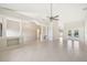 Spacious open floorplan living area showcasing decorative columns and bright tile flooring at 26180 Deep Creek Blvd, Punta Gorda, FL 33983