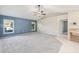 Bright living room with neutral paint, a ceiling fan, and tiled floors at 26180 Deep Creek Blvd, Punta Gorda, FL 33983