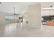 Spacious open floorplan with decorative pillars separating the living and kitchen areas at 26180 Deep Creek Blvd, Punta Gorda, FL 33983