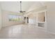 Bright living room with neutral walls, tiled floor, and large window at 26180 Deep Creek Blvd, Punta Gorda, FL 33983