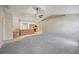 Open-concept living space with a connecting kitchen and tiled floors at 26180 Deep Creek Blvd, Punta Gorda, FL 33983