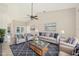 Cozy living room featuring vaulted ceilings, comfortable seating, and stylish decor at 26180 Deep Creek Blvd, Punta Gorda, FL 33983